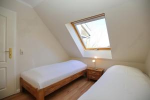 Postel nebo postele na pokoji v ubytování Feriendorf Papillon Wohnung 06-7