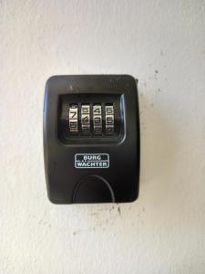 a black electrical outlet on a white wall at Old Town studio apartment in Larnaka