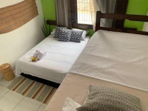 Cama ou camas em um quarto em Parnaíba Hostel
