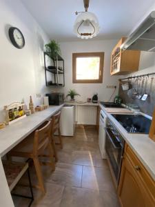 a kitchen with a sink and a stove top oven at Ferienhaus Dana in Steinhaus am Semmering