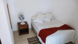 Cama ou camas em um quarto em Pousada Aquarela