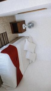 Cama ou camas em um quarto em Pousada Aquarela