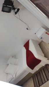 Cama ou camas em um quarto em Pousada Aquarela