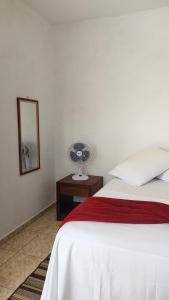 Cama ou camas em um quarto em Pousada Aquarela