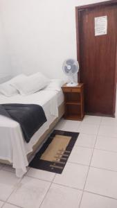 Cama ou camas em um quarto em Pousada Aquarela