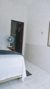 Cama ou camas em um quarto em Pousada Aquarela