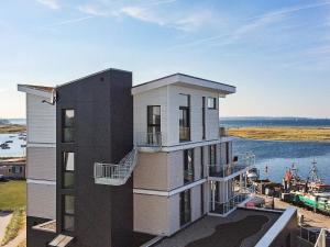 a building with a view of a marina at 8 person holiday home in Wendtorf in Wendtorf
