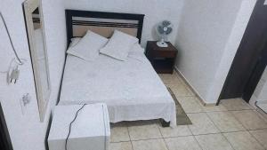 Cama ou camas em um quarto em Pousada Aquarela