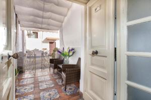 a door leading to a dining room with a table at Piazza Tasso B&B Relais in Sorrento