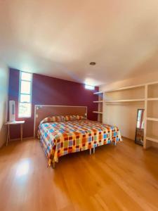 a bedroom with a bed in the middle of a room at Hotel Sierra Inn in Xicotepec de Juárez +29 photos