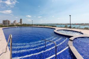 a large pool of water with a blue sky at Meriton Suites Southport in Gold Coast