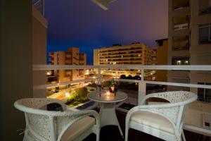 a balcony with two chairs and a table on a balcony at Moon Dreams Torremolinos in Torremolinos