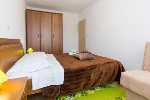Postel nebo postele na pokoji v ubytování Apartman Andrea