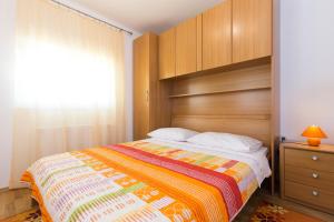 Postel nebo postele na pokoji v ubytování Apartman Andrea