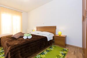 Postel nebo postele na pokoji v ubytování Apartman Andrea