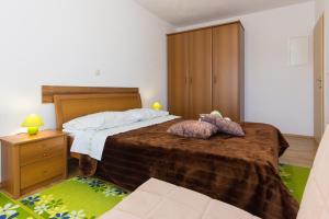 Postel nebo postele na pokoji v ubytování Apartman Andrea