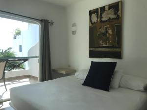 En eller flere senger på et rom på Casa 5 Palmas