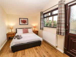 Ένα ή περισσότερα κρεβάτια σε δωμάτιο στο Snowdrop