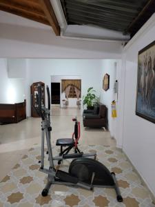a living room with a gym with a treadmill at Rosita 2 in Jardin