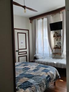 Кровать или кровати в номере B & B Les Secrets des Loges