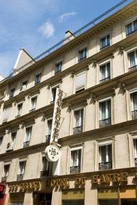 a building with a sign for a hotel at Grand Hôtel du Havre in Paris