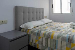 En eller flere senge i et værelse på Villa Playa y Centro Exclusive Accommodation