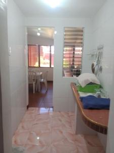 a room with a table and a dining room at Felipa Beach Residence - Ilang Ilang in Dumaguete