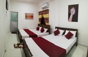 Voodi või voodid majutusasutuse Dive beach palace toas