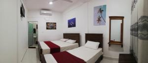 Postel nebo postele na pokoji v ubytování Dive beach palace