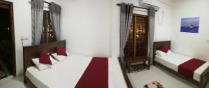 Voodi või voodid majutusasutuse Dive beach palace toas