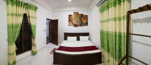 Voodi või voodid majutusasutuse Dive beach palace toas