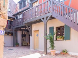 a building with a staircase on the side of it at Stunning Apartment in heart of Dambach La Ville in Dambach-la-Ville