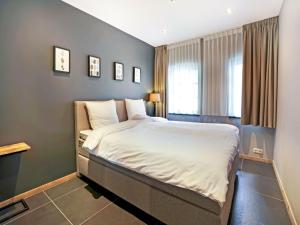 מיטה או מיטות בחדר ב-Cozy Apartment in Grubbenvorst In a Hotel With Terrace