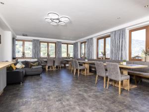 a dining room with a long table and chairs at Moiklerhof holiday home in Ramsau im Zillertal in Ramsau im Zillertal