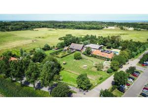 an aerial view of a house with a park at Tasteful apartment in Vrouwenpolder close to the beach in Vrouwenpolder