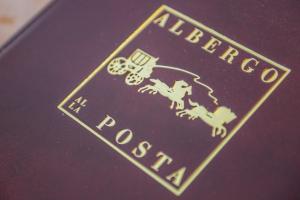 a close up of a book with the american tobacco logo at Albergo Alla Posta in Trieste