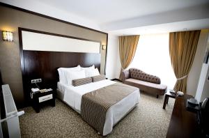 Postel nebo postele na pokoji v ubytování Lavin Hotel & Spa