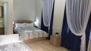 Voodi või voodid majutusasutuse Elegant Hotel toas
