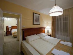 Postel nebo postele na pokoji v ubytování Hotel Villa Huber