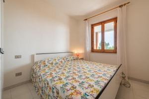 Ένα ή περισσότερα κρεβάτια σε δωμάτιο στο Casa delle Poiane Costa Rei