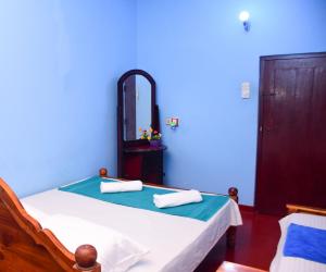 Postel nebo postele na pokoji v ubytování Relax Guest House Dambulla