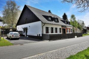 a black and white building on the side of a street at Na starém městě Volary in Volary