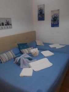 A bed or beds in a room at AFFITTACAMERE Il Cortile