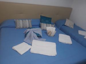 A bed or beds in a room at AFFITTACAMERE Il Cortile