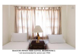 Postel nebo postele na pokoji v ubytování Agreeable Family Baguio Suites