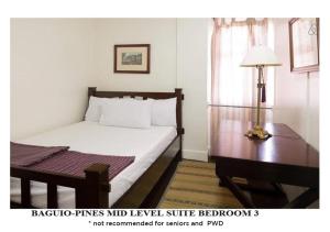 Postel nebo postele na pokoji v ubytování Agreeable Family Baguio Suites
