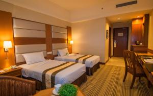 Postel nebo postele na pokoji v ubytování Pearl View Hotel Prai, Penang