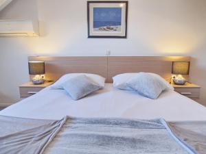 Postel nebo postele na pokoji v ubytování Apartment & Rooms Ivušić