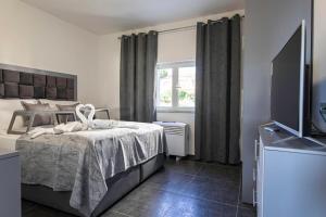 Postel nebo postele na pokoji v ubytování Villa Royal