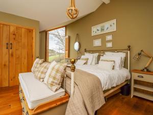 Ένα ή περισσότερα κρεβάτια σε δωμάτιο στο Ty Gwyn Cottage